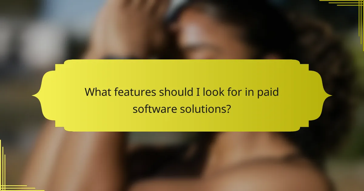 What features should I look for in paid software solutions?